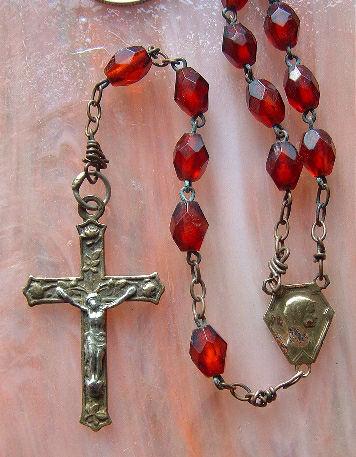 Just a lovely, very usable rosary. The center has a profile of Mary, while the reverse is the Grotto of Lourdes.