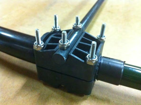 Insert #6 x 2 pan-head screw (PN 60-0156) through each of the coupler halves and the fiberglass rod.