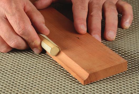 Double-edge dub A V-shaped sanding backer will ease both arrises of a panel edge at the same time.