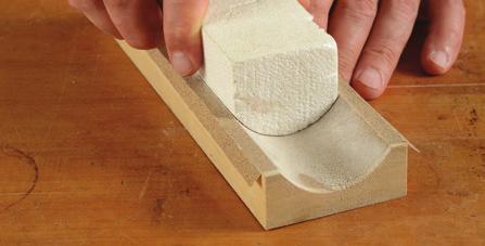 The fastest, cleanest sanding of profi les is achieved with a backer like this rubber contour sanding pad that presses the paper in full contact