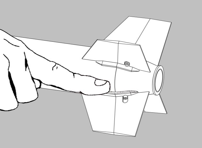 Using the printed fin guides and the drawn lines, glue a fin assembly at each position with the fin slot toward the bottom as shown. Repeat with the other three fin assemblies.