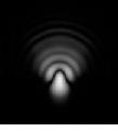 The first dark ring lies where the rays are out of phase and interfere destructively, and the remainder of the light and dark rings represent constructive and destructive interference at increasing