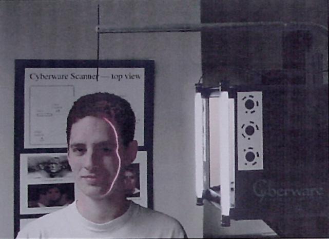 The figure on the right shows the teaching assistant being scanned and the resultant head model being displayed on the background