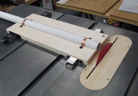 Photo 2 - The jig consists of a piece of 1" PVC pipe strapped down on a "dadoed" piece of 3/4"