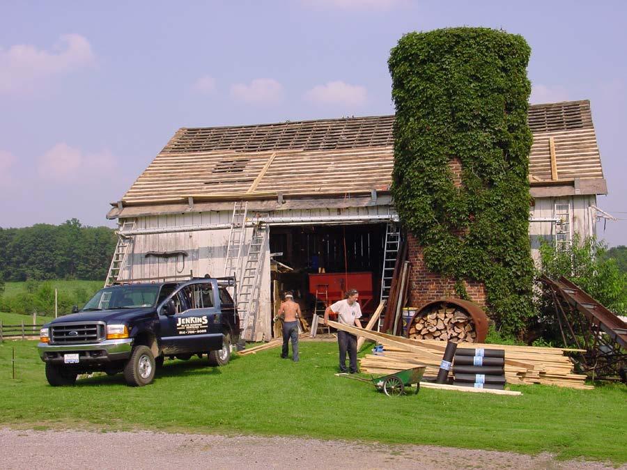 A lath barn being reslated by