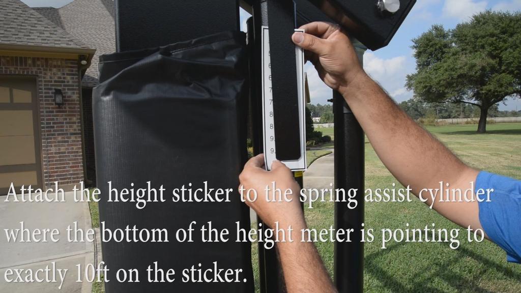 14) Height Meter and Sticker Assembly To apply the Rim Height Sticker (V) and Steel Rim Height Indicator (H), first use a tape measure to crank rim up to exactly 10' from the playing surface.