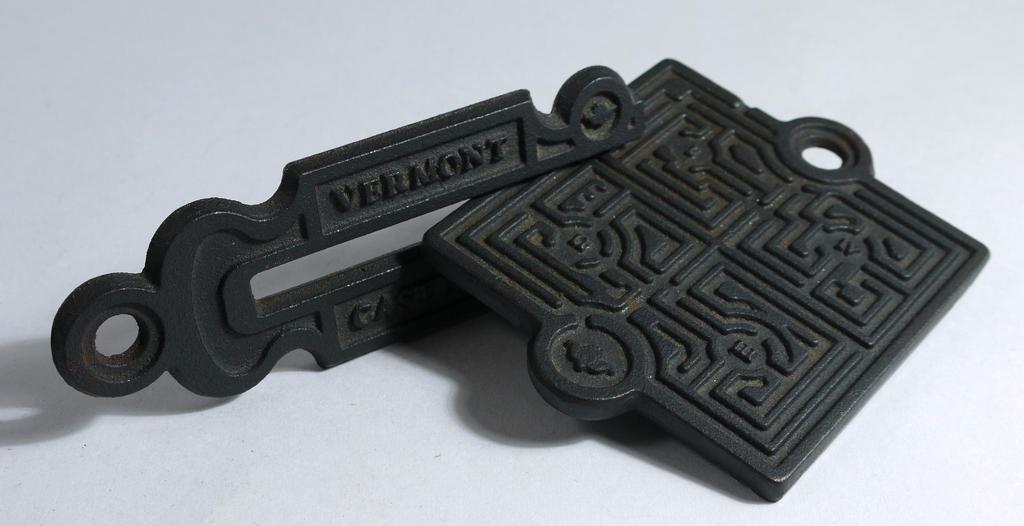 This heavy (440 gm) double sided maze was made in 1988 as an advertising promotion by cast-iron stove makers Vermont Castings.