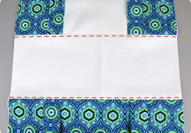Sew along this edge, then repeat this with the other side of the vinyl and the back of the bag.