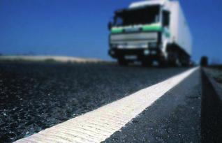 Materials are applied to the surface of the road markings in order to enhance performance characteristics, such as visibility and skid resistance.