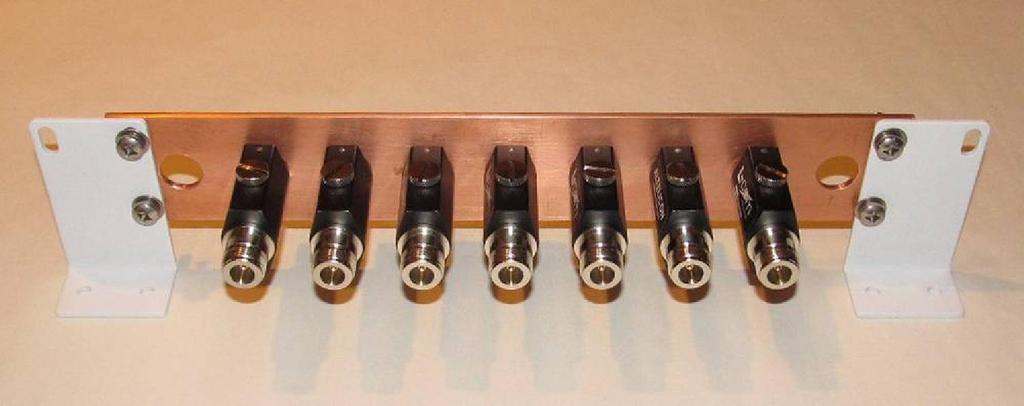 Another alternative is to use a copper busbar with coaxial feed-through type bulkhead connectors or coaxial lightning arrestors (figure 8).