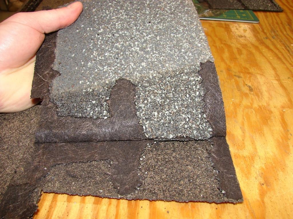 Another way to illustrate the amount of adhesion an asphalt seal strip is designed to achieve is to intentionally pull apart the top and bottom pieces of a dimensional shingle.