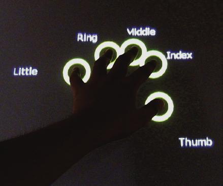 The finger registration process is activated whenever the user places a hand, in any orientation, anywhere on the touchscreen.