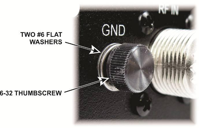 Place two #6 flat washers on the black thumbscrew and thread it into the threaded bushing GND next to the RF IN connector on the rear panel as shown in Figure 5.