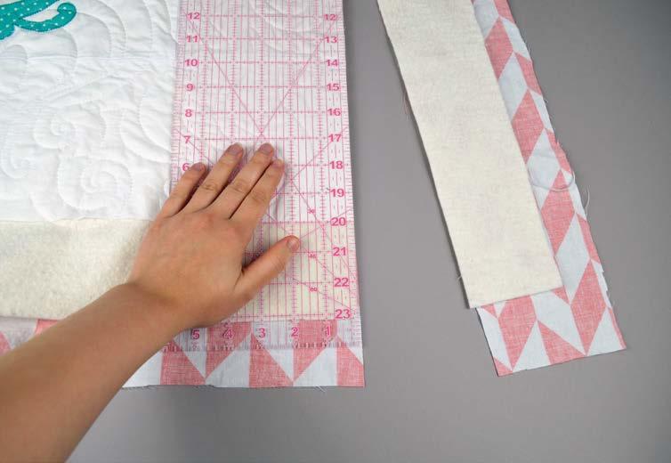 3 TRIM THE LAYERS: When the layers are all quilted, you can now trim off the excess batting and backing to leave three cleanly sewn layers behind.
