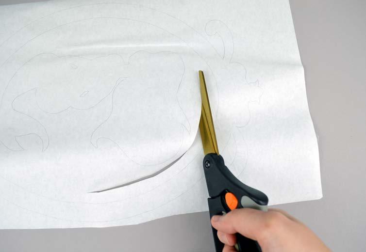 3 TRACE THE DESIGN: Layer your fusible web over the paper pattern with the adhesive (bumpy) side down.