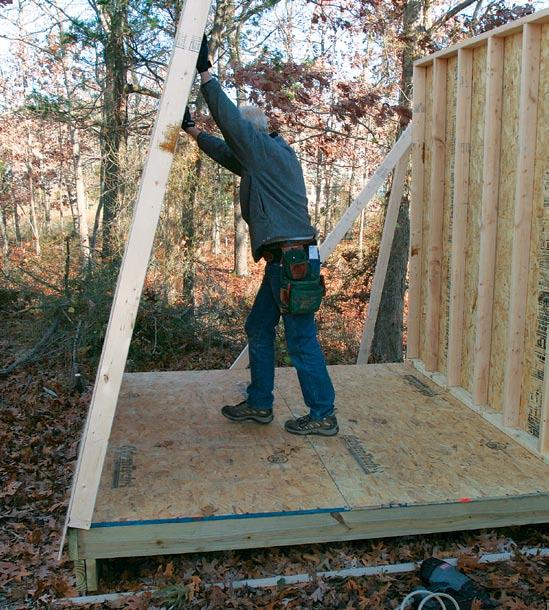 floor deck is a perfect platform for wall framing A big blade chops studs with a single cut.