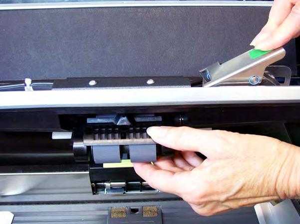 4. Push down on the release lever (located underneath the printer access cover) to release and remove the feed module. 5. If you are just replacing the feed module, do the following.