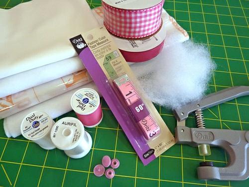 1¼ yards of 1½ wide ribbon in a pretty print; we used a pink gingham ribbon, purchased locally ½ yard of ⅝ ribbon in a coordinating solid; we used a pink grosgrain ribbon, purchased locally Scrap or