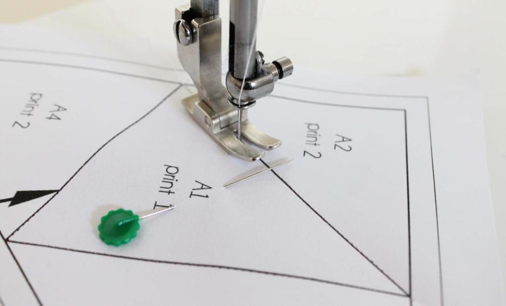 5. With the printed side of the paper facing you, carefully hold these pieces in place as you unfold your