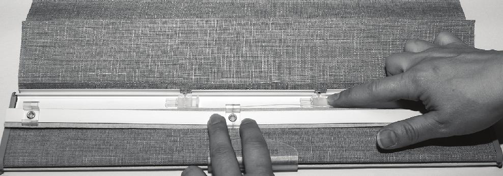 OPERATION Problem The shade drop is too low or too high or the middle rail on a Top-Down/ Bottom-Up is too low or uneven. Solution Unsnap the fabric flap on the bottom rail. Each cord can be adjusted.