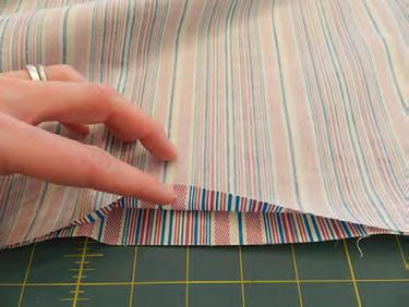 Center the Shape-Flex onto the wrong side of each piece of lining fabric.