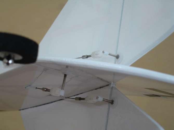 Install the tail gear into the fuselage and secure it in place with 2x8mm tapping