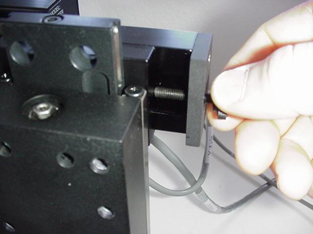 Figure 4: a) Perpendicular adjustment bracket; b) dovetail stop-screw adjustment.