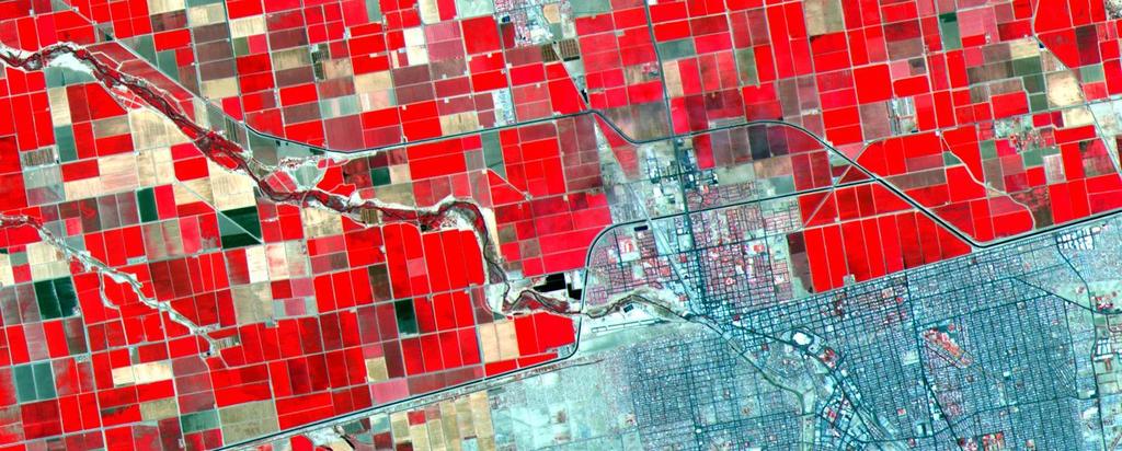 The border town of Mexicali-Calexico spans the border in the middle of the image; El Centro, California is in the upper