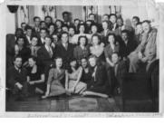 The sorority was either Delta Delta Delta or the Alpha Mu Chapter of Kappa Beta Pi. Thelma Thomson is in the second row from the top, kneeling by the pillar.