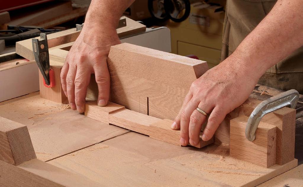 One thing to keep in mind when laying out those joints is that an arch will eventually be cut in the rails. So center the mortise on the finished profile, rather than on the square blank.
