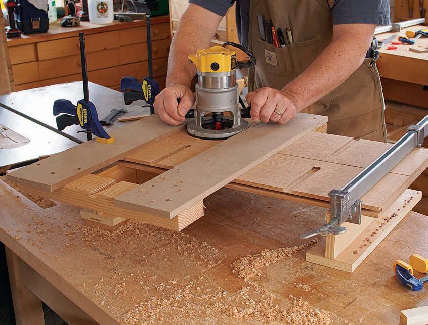 A two-part tabletop Make way for a spline and dovetail keys. Start by ripping a groove along the inside edge of each half (above).