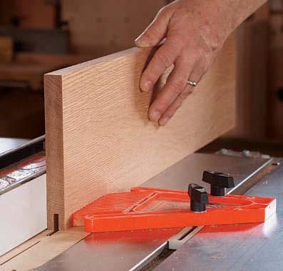 With the mating edges facing out, use a two-sided fence to guide the router. This lets you rout safely in from each end, stopping short of the center.