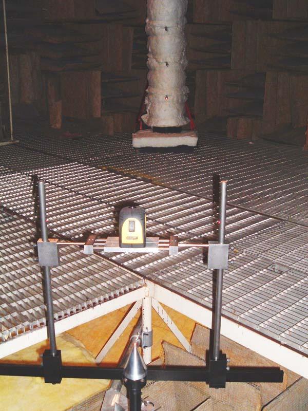 Photo 5 Alignment of turntable/yoke to 90 mic (Note laser beam in circled areas) Taming the Chamber During the course of setting up and calibrating the measurement environment (anechoic chamber)