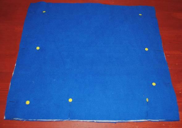 To assemble outer body layers, place one fleece body layer on table, place one outer