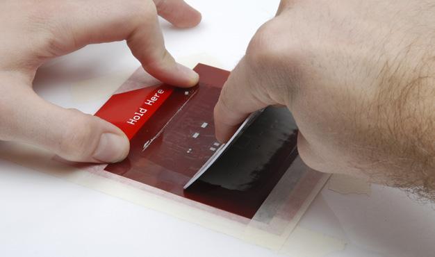 On this swipe we are going to remove the excess paste from the stencil so that only the paste on our pads remains.