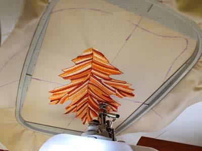 Hoop the fabric and stabilizer together, aligning the marks on the hoop with the