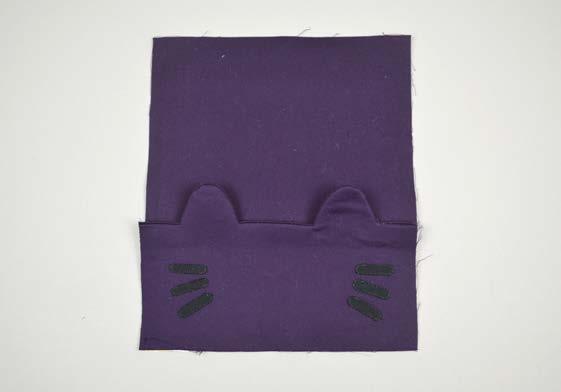 Baste the edges of the ears to keep them from moving while the rest of the wallet is sewn.