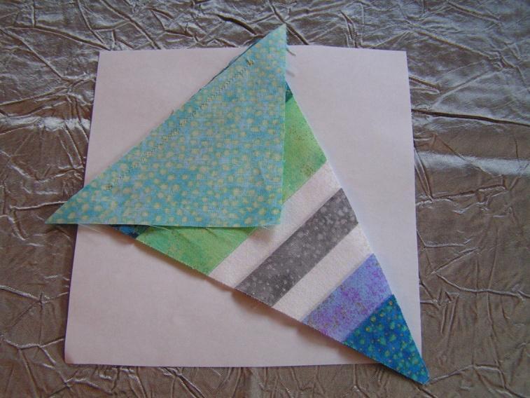 6. Unfold the paper and stitch right on the