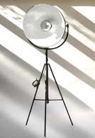 Adjustable table lamp. Glare shield shade in chrome-planted aluminium. Inside in white-laquered aluminium. Rough surface.