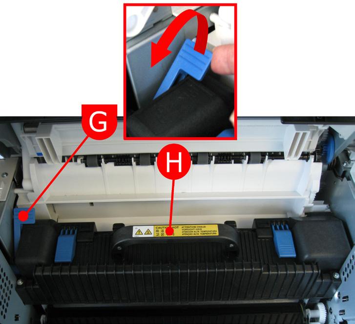 12. Pull the blue lock lever (G) towards the front of the
