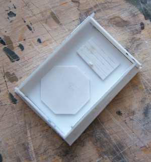 Fig. 16 4) Casting As I wrote at the end of par. 2, I decided to make a mold for casting the bunker from gypsum. I placed the bunker on a plastic sheet and fixed it with PVA glue.