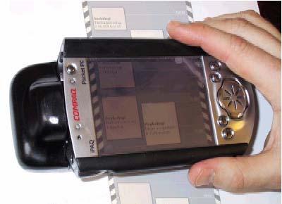dragged over the flat surface. Figure 4. Picture taken of the ScrollPad in use during this initial user study. Fig. 2. Stylus scrolling on the PDA. 5.