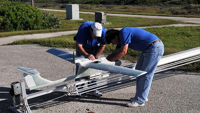 NASA KSC s Research and Technology (cont d) UNMANNED AERIAL VEHICLE (UAV) APPLICATIONS Development of Fixed-Wing UAV s for