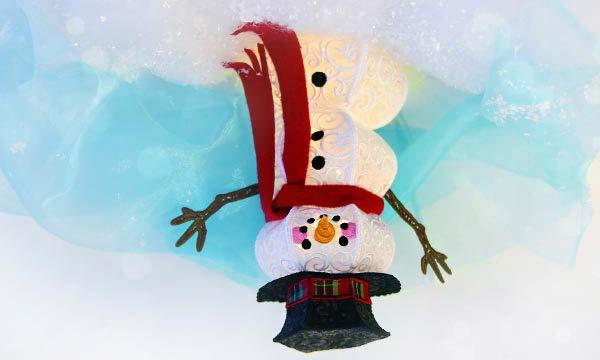 3D Lace and Organza Snowman Create an enchanting winter wonderland with this friendly snowman! Stitch the fabric-accented lace pieces individually, then stitch them together to build your snowman.