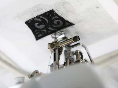 Place the hoop back on the machine, and continue to embroider the design.