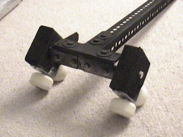 Note the wing nuts are on the part of the Tee brace sandwich (which sandwiches the L bar) that attaches to the longer un-cut L bar.