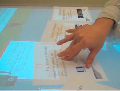 4 Experiments with paper-based or paper-inspired interfaces. Left: physical copies of virtual documents are used to move the virtual documents over a flat surface.