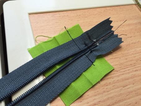 This piece basically becomes binding on the ends of the zipper.