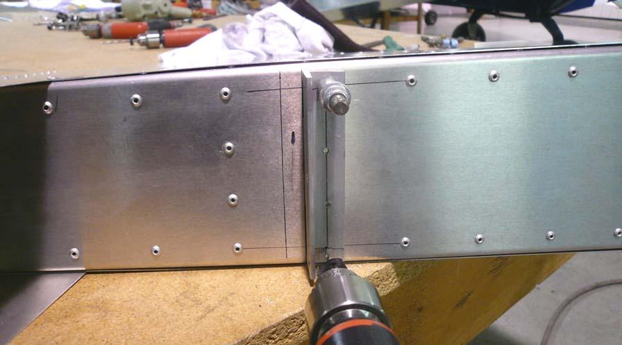 Position the Hinge Angle so the edge of the top flange is flush with the line and the lines are visible through the predrilled holes.