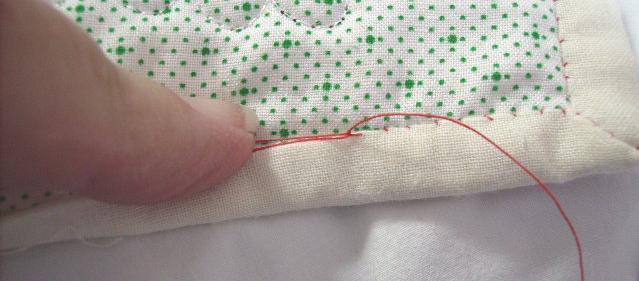 19. Hold onto the loop of thread and pull the needle